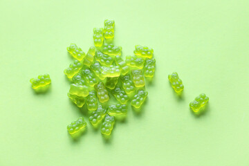 Wall Mural - Sweet jelly bears on green background