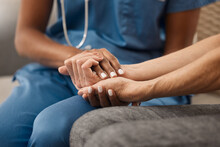 Its Okay If Youre Not Feeling Okay. Shot Of A Doctor Holding Hands With Her Patient During A Consultation At Home.