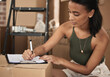 © Siphosethu F/peopleimages.com - Moving house is another way to have a new beginning. Shot of a young woman signing a contract at home.
