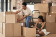 © Siphosethu Fanti/peopleimages.com - After moving house the hard part comes unpacking. Shot of a young couple packing up to move in a room at home.