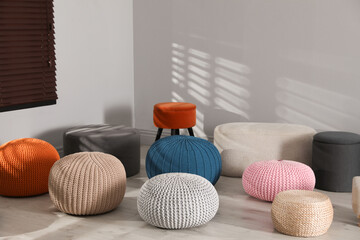 Canvas Print - Many stylish different poufs in room. Home design