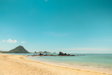 Wall Mural - The sloping Kute Beach in Lombok, with its calm waters, is the main attraction of Lombok island tourism, West Nusa Tenggara, Indonesia.