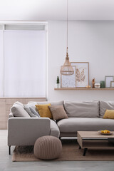 Wall Mural - Stylish living room interior with comfortable grey sofa and coffee table