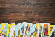 Tarot Cards On Wooden Table, Top View. Space For Text