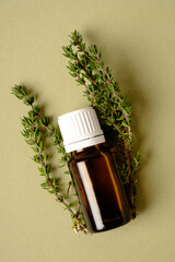 Poster - Thyme Essential Oil Bottle with Thyme Bunch