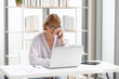 © offsuperphoto - senior businesswoman or freelance using laptop computer and talking about work on phone