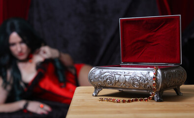 Jewelry Box with Woman in Corset in background, Shallow DOF, Focus on Jewelry Box