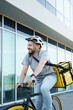 © blackday - Express delivery courier riding bicycle with insulated bag.
