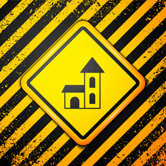 Black Church building icon isolated on yellow background. Christian Church. Religion of church. Warning sign. Vector