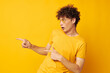 © Tatiana - portrait of a young curly man wearing stylish glasses yellow t-shirt posing Lifestyle unaltered