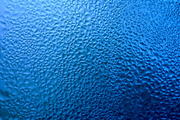 Wall Mural - water drops on blue background