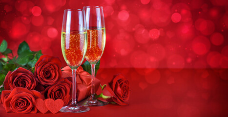 Wall Mural - Romantic date night concept. Champagne, hearts, gift and roses on a festive red background.