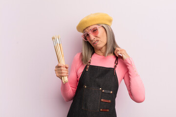 Wall Mural - middle age woman feeling stressed, anxious, tired and frustrated. artist painter concept