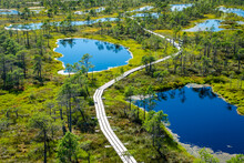 View Of The Bog From Above With A Wooden Boardwalk And Lakes