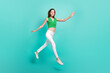 © deagreez - Full length profile side photo of young lady active go hurry motion jump isolated over turquoise color background