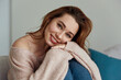 © Drobot Dean - Young caucasian girl resting on sofa at home