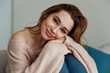 © Drobot Dean - Young caucasian girl resting on sofa at home