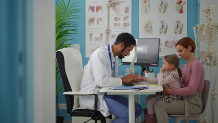 Wall Mural - little girl with her mother at doctor's office on consultation.