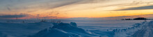 Panorama With Snow-covered Expanse And Sunset Sky