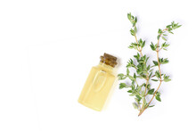 Thyme Extract Essential Oil With Fresh Thyme Herbs Isolated On White Background. Top View. Flat Lay.