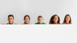 © Prostock-studio - Happy Multicultural Children Posing With Empty White Poster, Gray Background