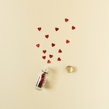 Creative Scene Made Of Red Hearts And Medicine Bottle. Flat Lay Background. Love Concept.