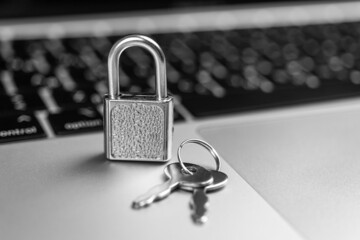 computer security concept. padlock on computer keyboard, laptop in office. cyber security and privac