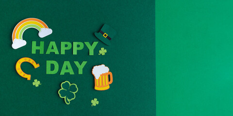 St. Patrick's Day. Banner design on green background with HAPPY ST. PATRICKS DAY and typical decorations. Copy space. 