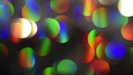 Wall Mural - Rainbow Bokeh Abstract Motion. Multicolor bokeh gradients moving slowly, shimmer, glare and blend and light leaks on a dark background. Can be used as a backdrop or overlay.
