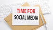 © Iryna - Text TIME FOR SOCIAL MEDIA on the envelope on the keyboard