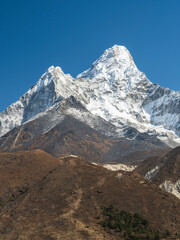 Wall Mural - coffee colours of hills and view to snow peak ama-dablam under blue sky in nepal