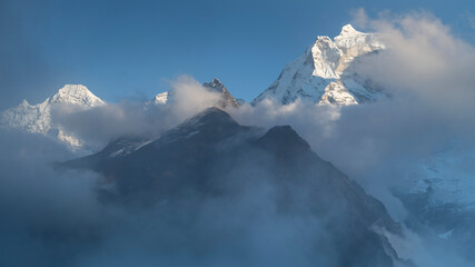Wall Mural - mountains and snow peaks in clouds in summer day in nepal