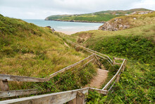 Foot Path To Barley Cove Beach. Ocean And Green Fields In The Background. County Cork, Ireland. Popular Tourist Location