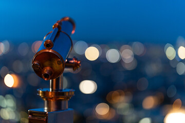 Vintage telescope over paris by blue hour