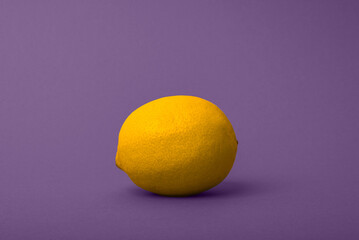 yellow lemon on a purple background