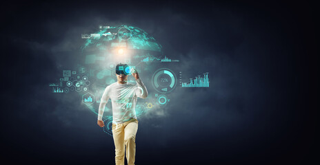 Wall Mural - man wearing virtual reality goggles