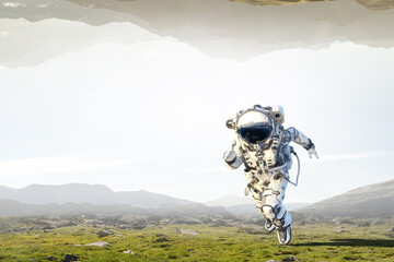 Wall Mural - astronaut walking on an unexplored planet