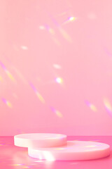 Wall Mural - Abstract minimal scene - empty stage, cylinder podiums on soft pink background with rainbow crystal light refraction sparkles. Pedestal for cosmetic product and packaging mockups display presentation