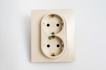 Double socket insulated on a white background. 2 sockets connected by one monolithic housing. The socket has two plug connectors, but is installed in one standard socket.