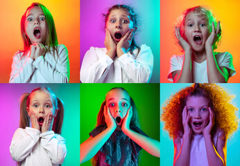 Wall Mural - Children's emotions. Set of portraits of little cute kids, boys and girls isolated on multicolored studio background in neon light. Education, wow emotions