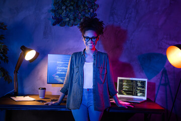 Photo of smart lady designer stand desk java script service error solving in evening late workplace workstation