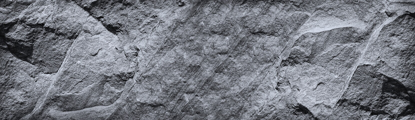 Wall Mural - black white rock texture. mountain surface. close-up. gray granite stone background with copy space 