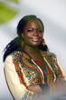 © ADDICTIVE STOCK - Happy curvy woman in stylish african outfit