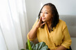 © Louis-Photo - Portrait of an african woman sit on the sofa