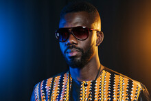 Serious Young Man With African Outfit And Sunglasses