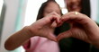 © Marco - Mother and child girl doing heart sign symbol with hands