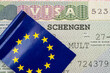 Close-up of Schengen visa with flag of EU