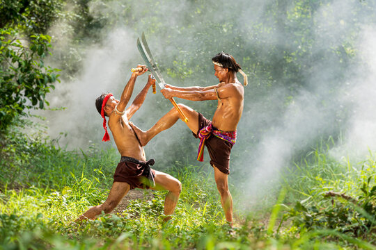 Man dancing thai sword. Ancient warrior man of soldier of Thailand.