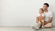 © Prostock-studio - Fatherhood Concept. Portrait Of Young Happy Dad With Infant Son On Arms