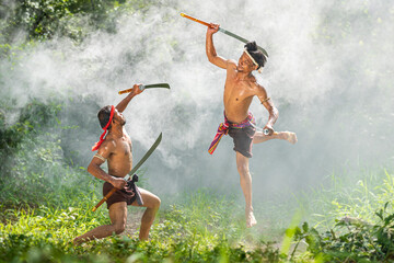 Poster - Man dancing thai sword. Ancient warrior man of soldier of Thailand.